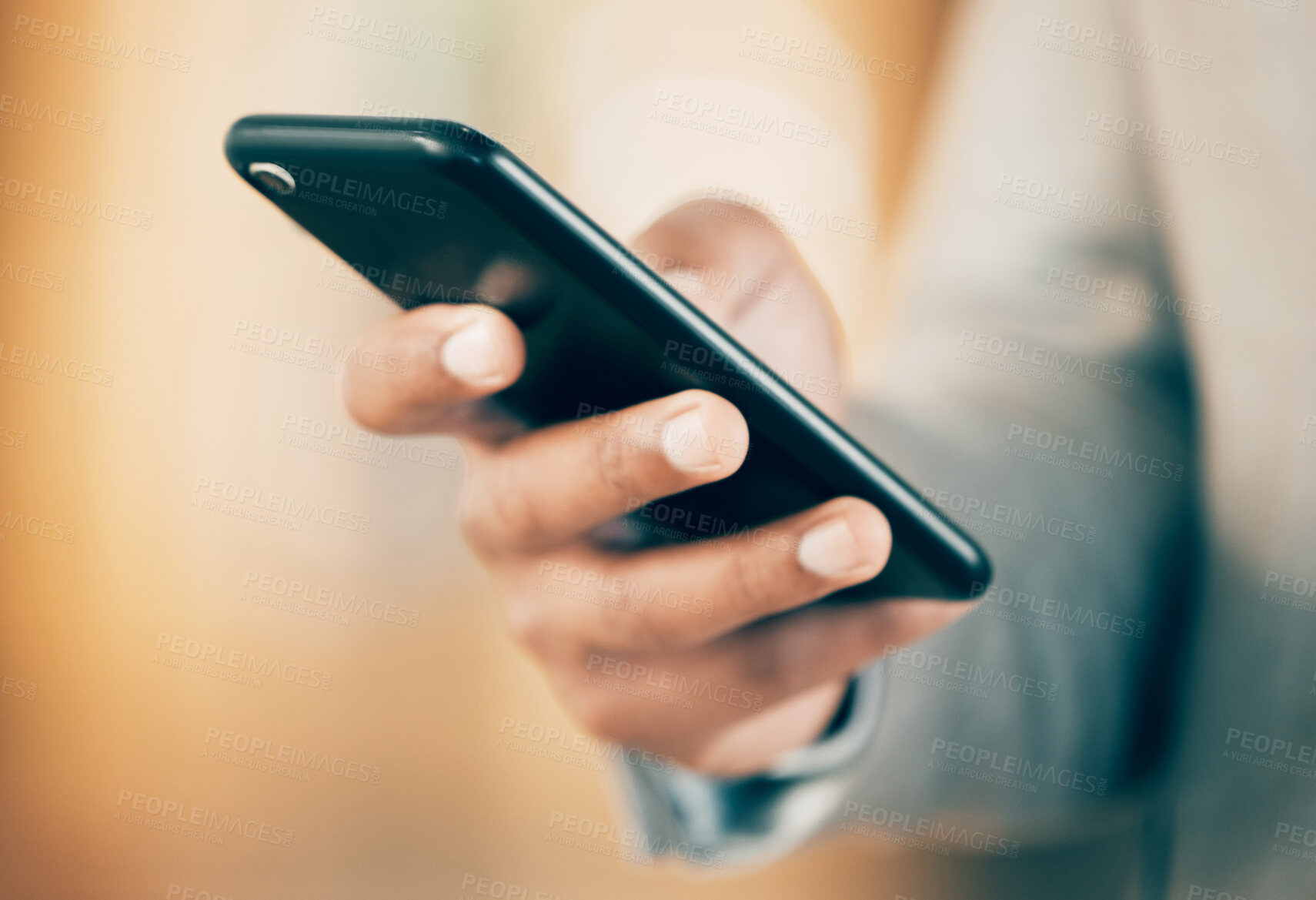 Buy stock photo Shot of an unrecognizable businessperson using a phone at work