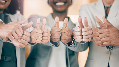 Buy stock photo Shot of a group of unrecognizable businesspeople showing a thumbs up at work