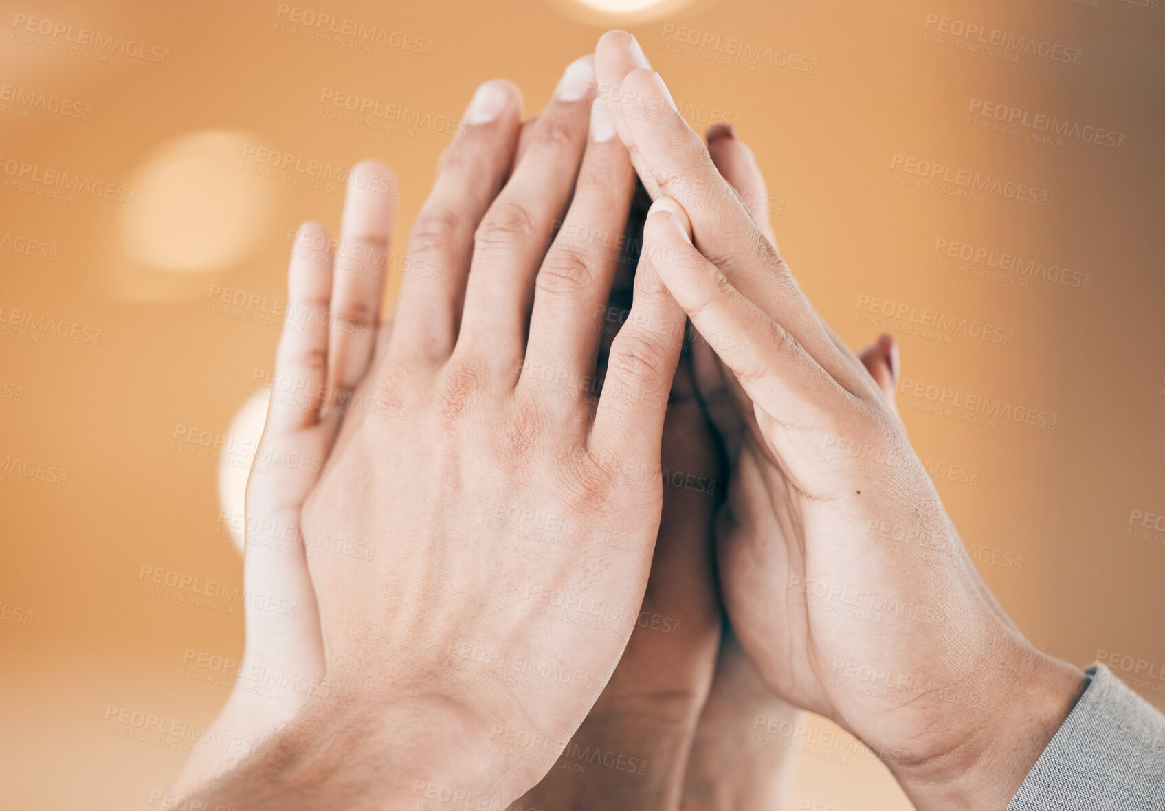 Buy stock photo Shot of a group of unrecognizable businesspeople giving each other a high five at work