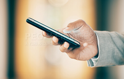 Buy stock photo Shot of an unrecognizable businessperson using a phone at work