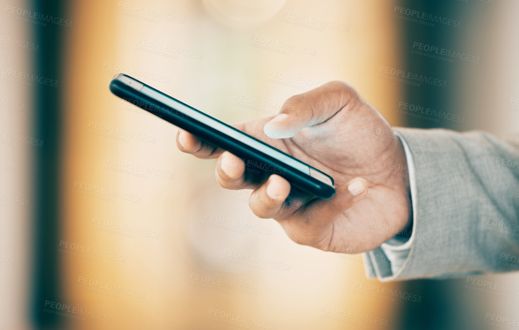 Buy stock photo Shot of an unrecognizable businessperson using a phone at work