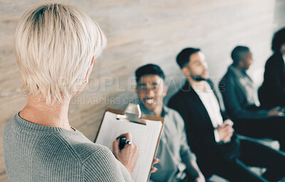 Buy stock photo Shot of a group of new employees having a discussion with the recruiter at an office