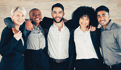 Buy stock photo Shot of a group of confident businesspeople standing together in an office