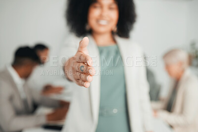 Buy stock photo Shot of a young businesswoman extending her hand out for a handshake at work