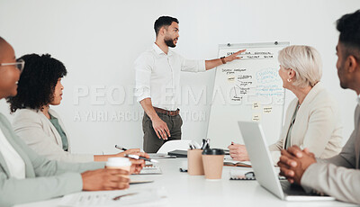 Buy stock photo Shot of a group of businesspeople in a meeting at work