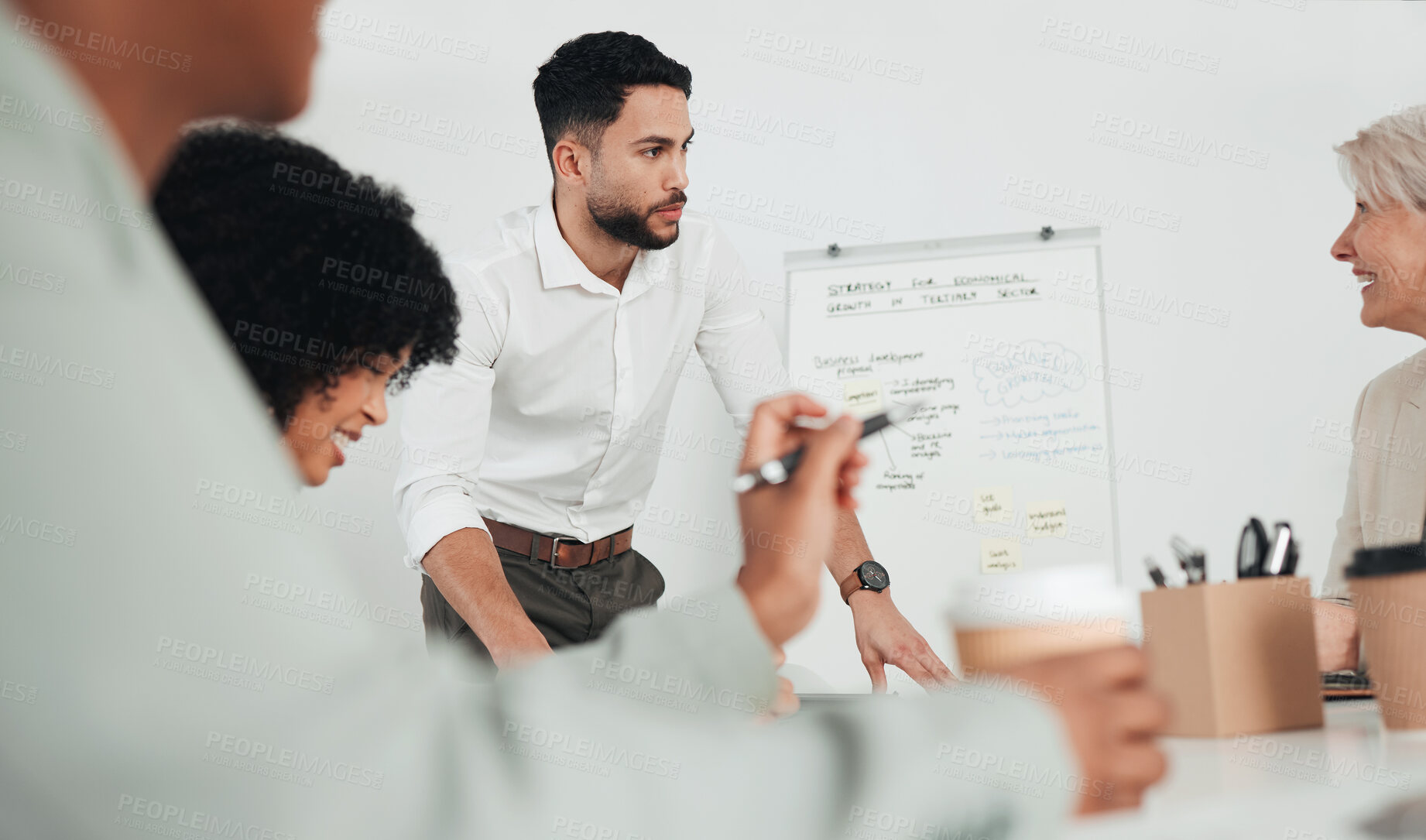 Buy stock photo Shot of a group of businesspeople in a meeting at work