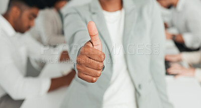 Buy stock photo Shot of an unrecognizable businessperson showing a thumbs up at work
