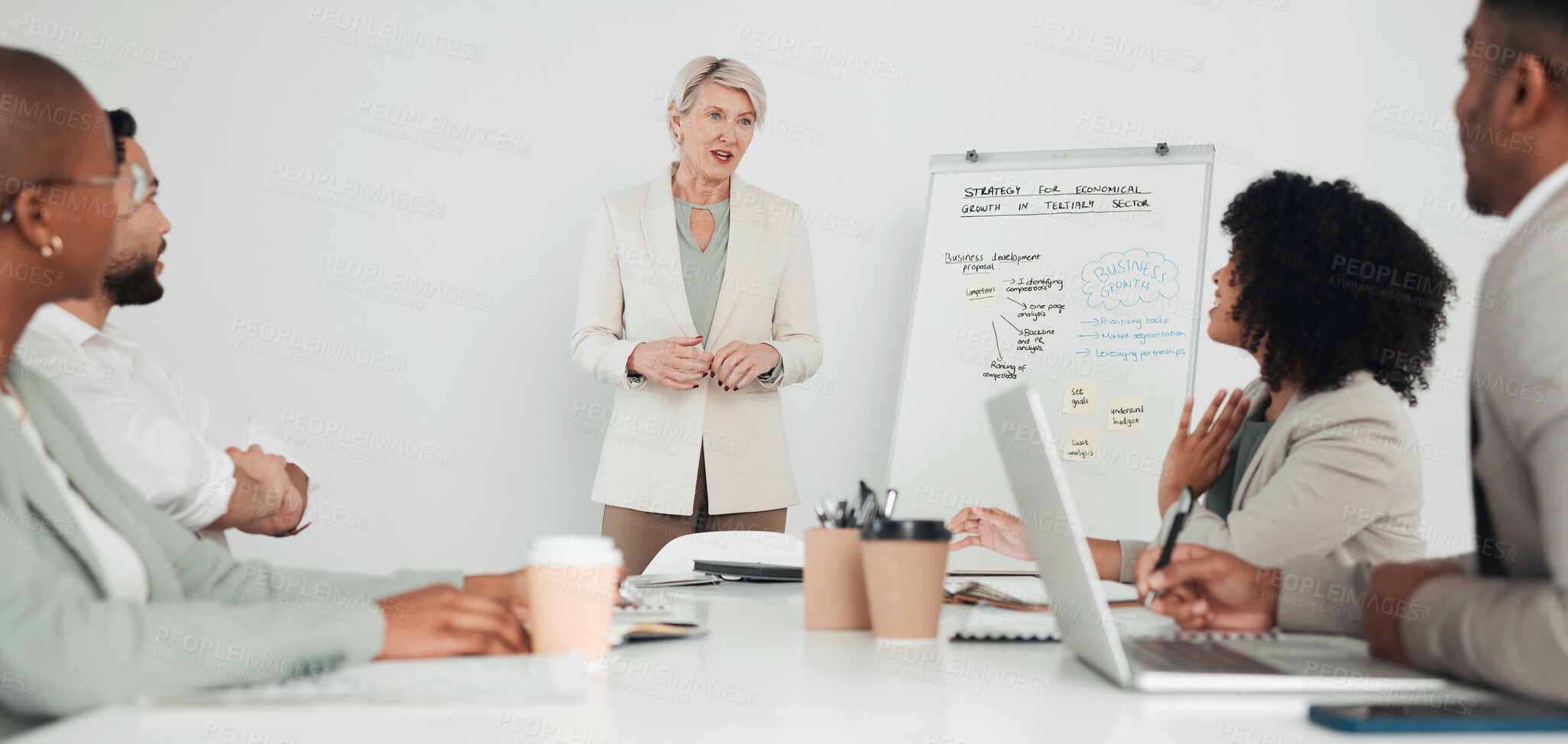 Buy stock photo Shot of a group of businesspeople in a meeting at work