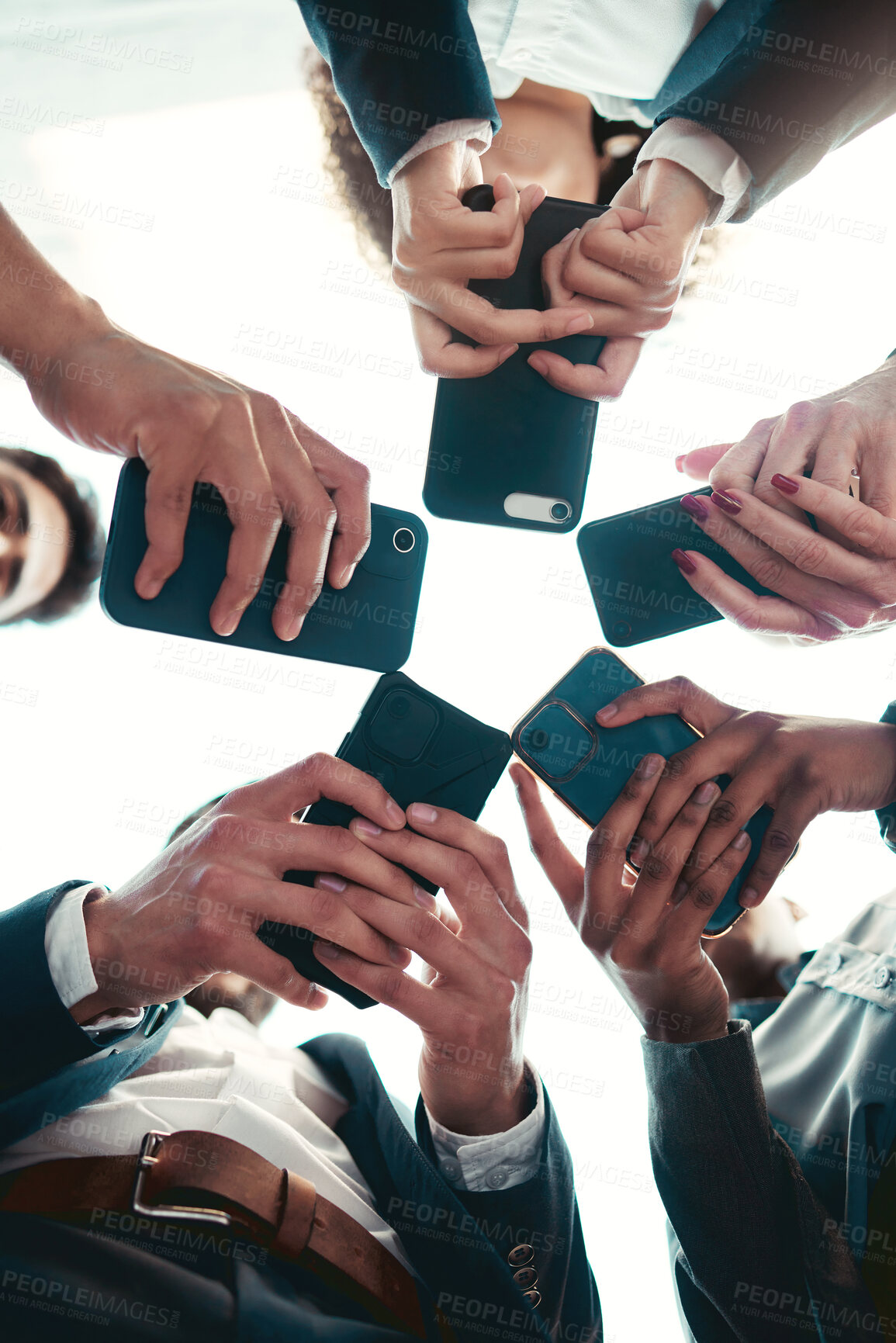 Buy stock photo Smartphone, hands and technology for business people, collaboration or communication in team for company. Chat, internet and brainstorming for networking, typing and teamwork huddle circle from below
