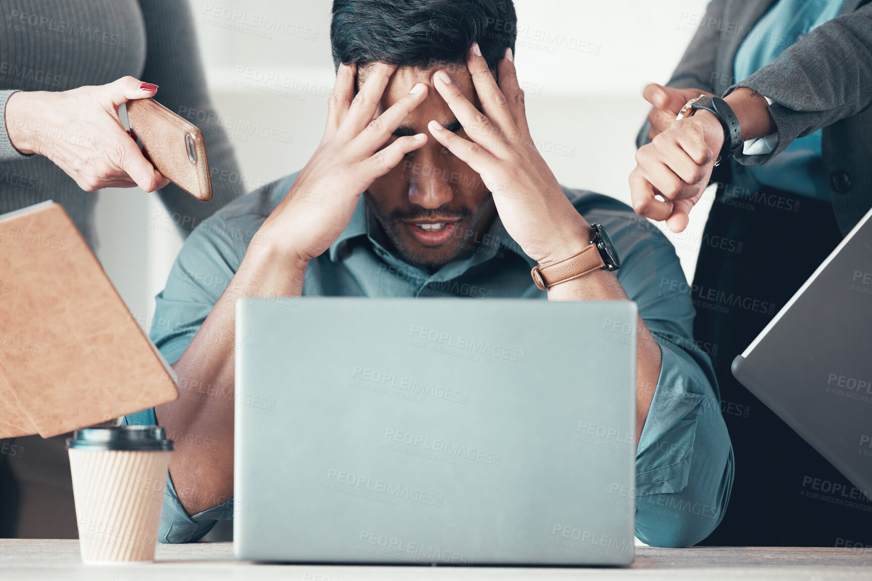 Buy stock photo Shot of an unrecognisable businessman sitting in the office and feeling stressed while his colleagues put pressure on him