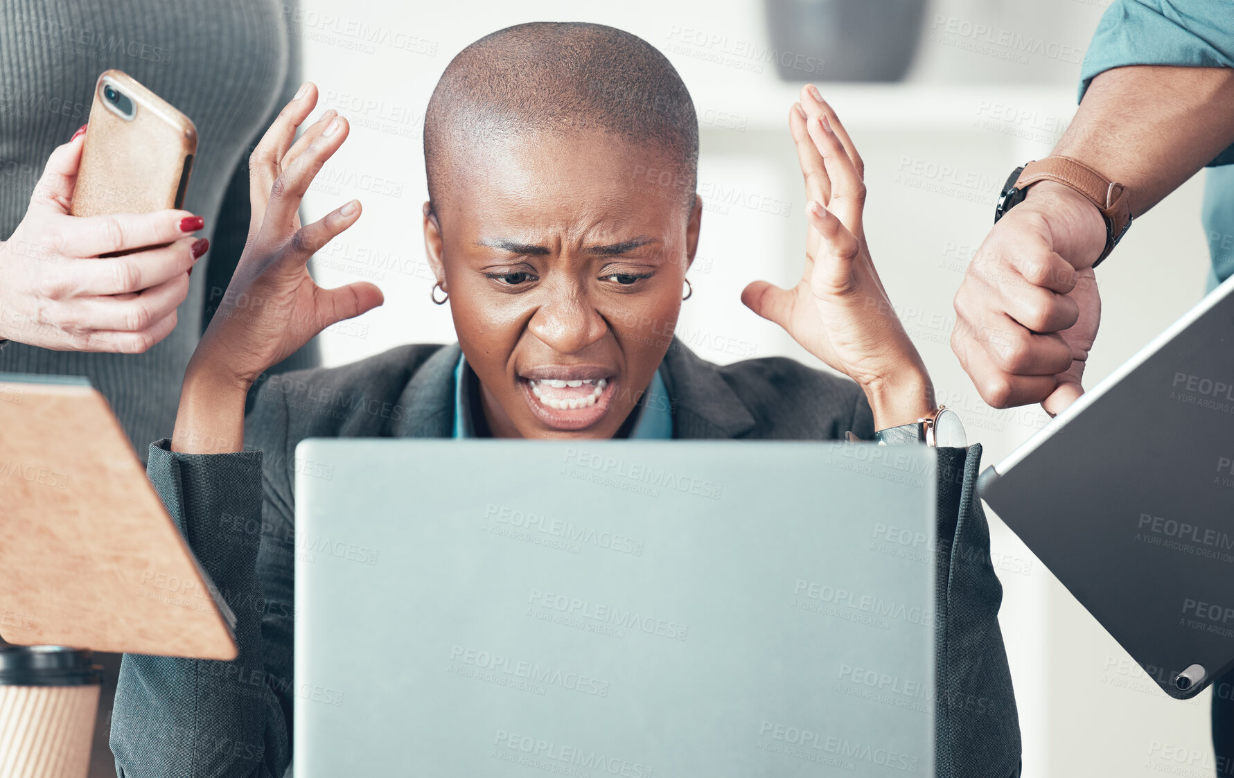 Buy stock photo Shot of an attractive young businesswoman sitting in the office and feeling stressed while her colleagues put pressure on her