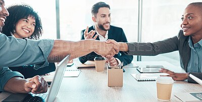 Buy stock photo Shot of a diverse group of businesspeople sitting in the office together and shaking hands during a meeting