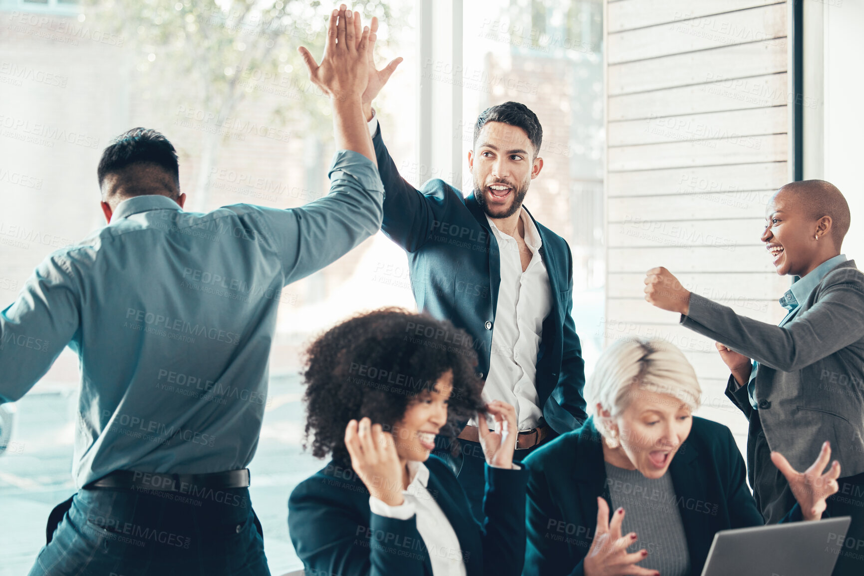 Buy stock photo High five, colleagues celebrating and at office of their workplace with a lens flare together. Success or achievement, happy and diverse coworkers support or with celebration at their workspace