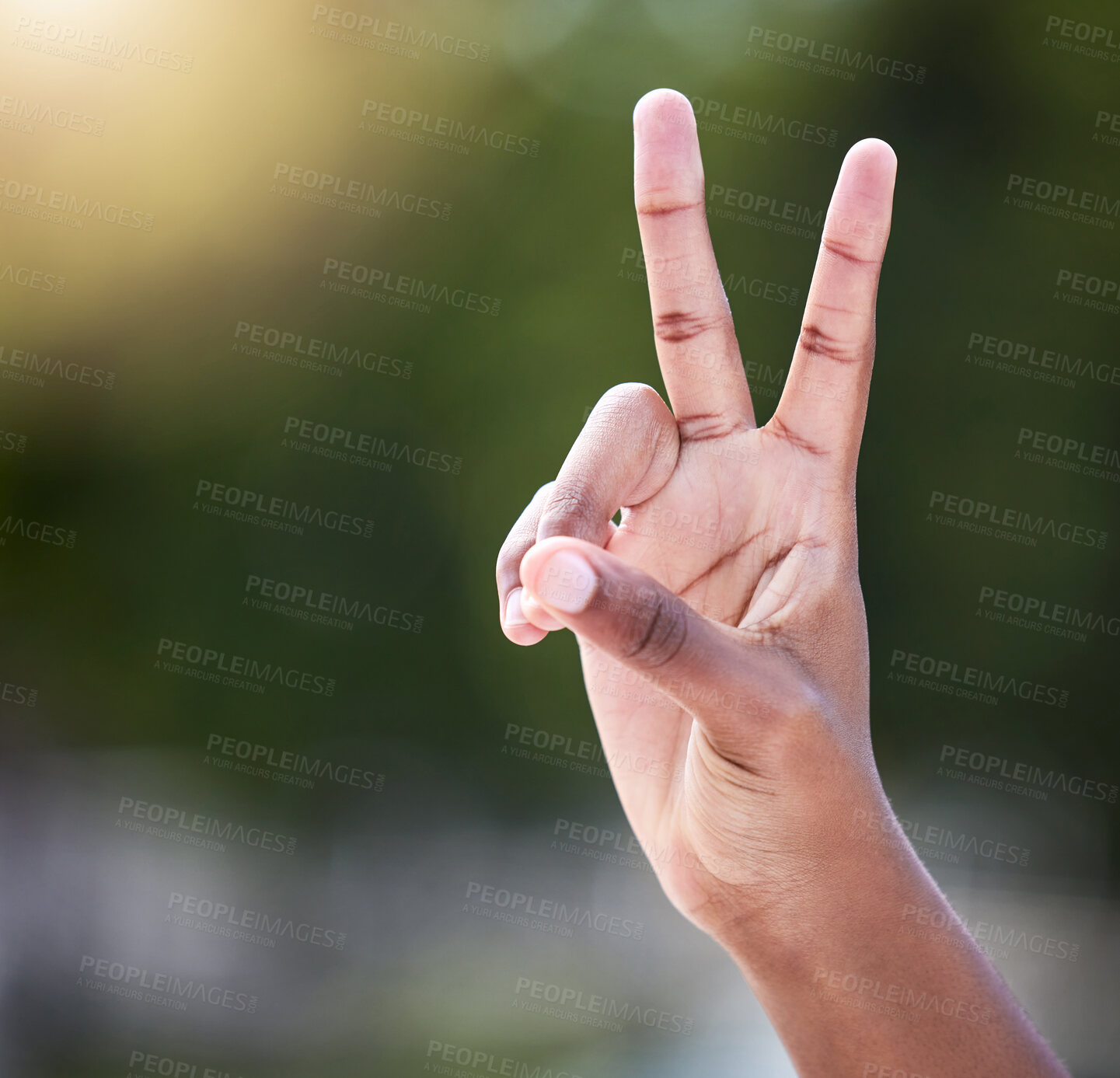 Buy stock photo Shot of an unrecognizable person showing a thumbs up outside