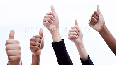 Buy stock photo Shot of a group of unrecognizable businesspeople showing a thumbs up outside