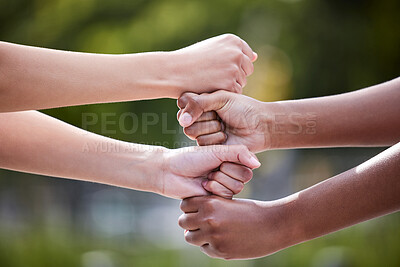 Buy stock photo Shot of two unrecognizable people stacking their hands outside