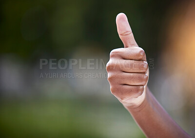 Buy stock photo Shot of an unrecognizable person showing a thumbs up  outside