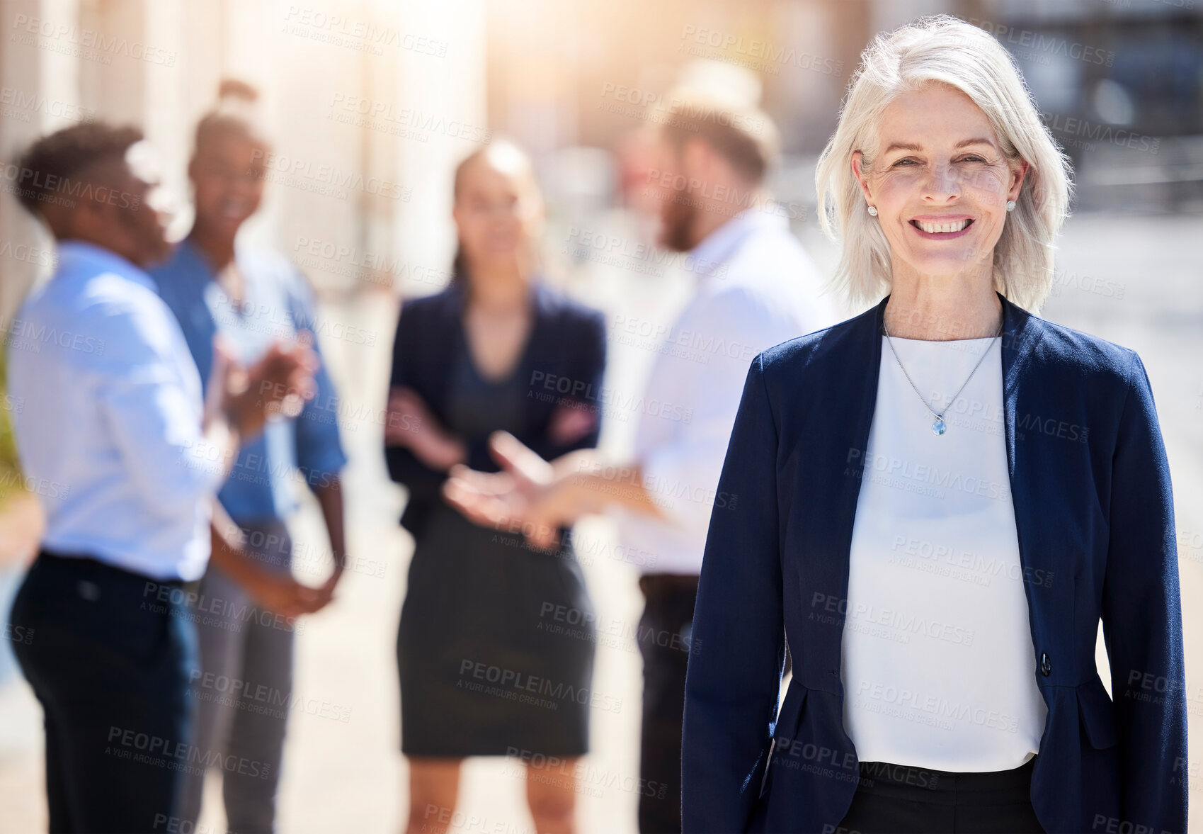 Buy stock photo Shot of a mature businesswoman standing outside