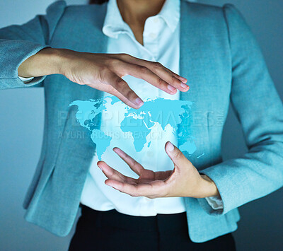 Buy stock photo Cropped shot of an unrecognisable businesswoman standing alone in the office and holding a cgi globe