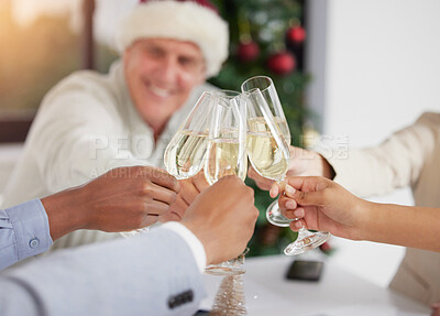 Buy stock photo Shot of a group of unrecognizable businesspeople drinking champagne at work