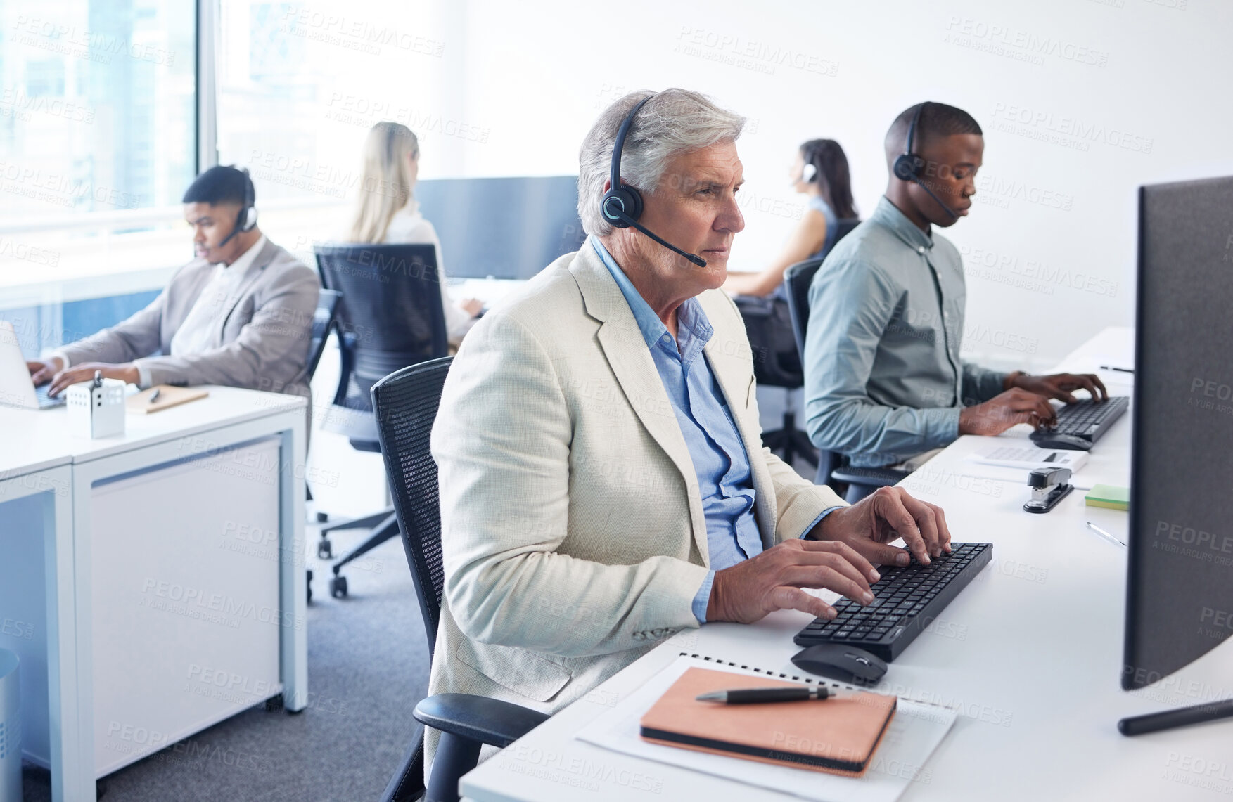 Buy stock photo Mature businessman, computer and working in call center for client support, telecom and crm in office. Male agent, lead generation and typing by pc for customer service, telemarketing and contact us