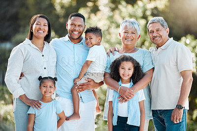 Buy stock photo Shot of a multi-generational family standing together outside