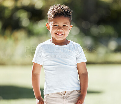 Buy stock photo Shot of an adorable little boy standing outside