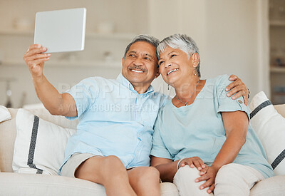 Buy stock photo Technology, selfie and married couple with tablet on a sofa in living room of their home. Happiness, social networking and love with elderly people on an online video call with internet connection
