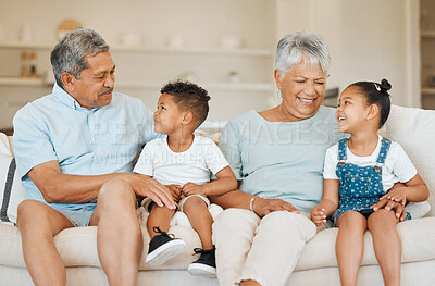 Buy stock photo Shot of grandparents bonding with their grandchildren on a sofa at home