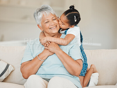 Buy stock photo Family, girl hug and kiss grandmother with happiness and bonding, smile with affection at home. Love, care and trust with elderly woman and young child in living room, embrace and happy at house