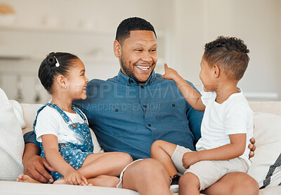 Buy stock photo Love, family and smile in home, bonding and fun in living room on house sofa. Parent, father and happy children with girl and boy for hug, relax and together in lounge on couch with funny joke