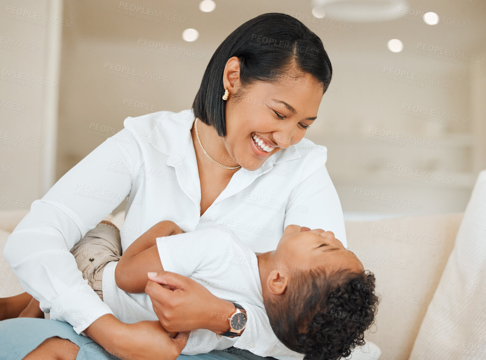 Buy stock photo Sofa, mother and child with laugh while playing, connection and bonding together with tackle game on weekend. Family, mama and boy at home for embrace, security and parenting on couch in living room