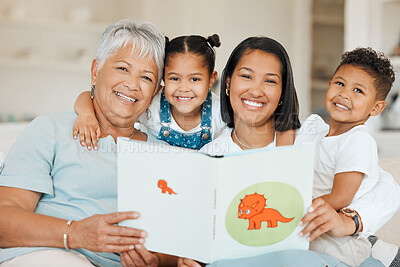 Buy stock photo Shot of a family reading a story book together at home