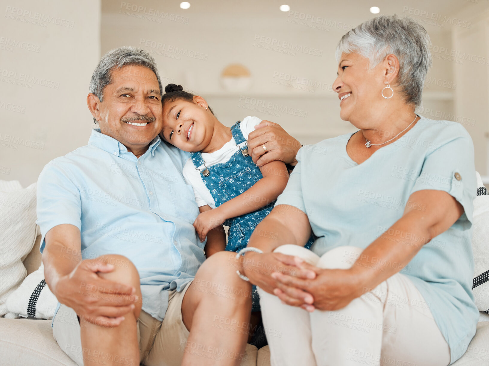 Buy stock photo Love, family and smile in home, bonding and fun in living room on house sofa. Grandparents, couple and happy grandchild with grandmother and grandfather for hug, relax and together in lounge