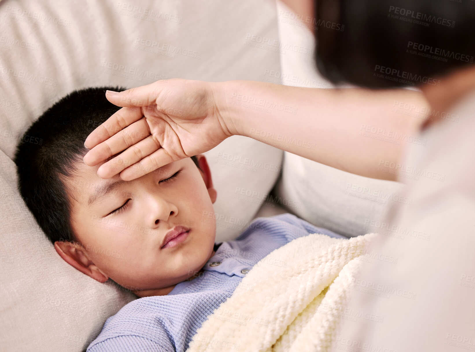 Buy stock photo Cropped shot of a woman checking her sick child's temperature