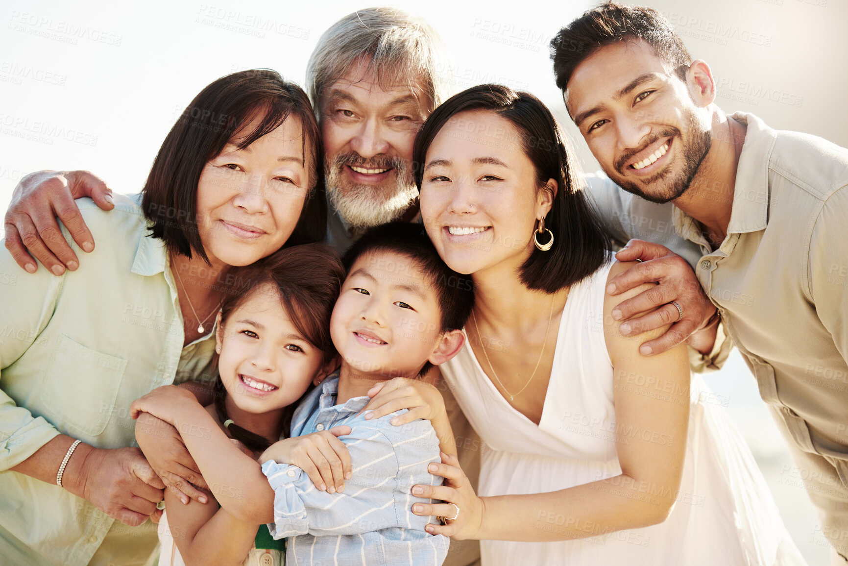 Buy stock photo Cropped shot of a happy diverse multi-generational family at the beach