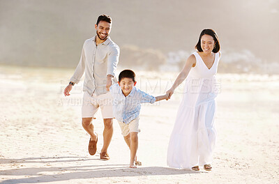 Buy stock photo Full length shot of a happy diverse family of three at the beach