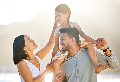 Buy stock photo Cropped shot of a happy diverse family of three at the beach