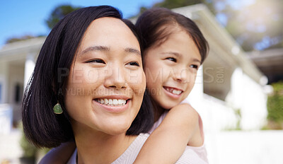 Buy stock photo Shot of a young mother and daughter spending time together in the garden at home