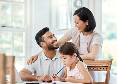 Buy stock photo Shot of young parent helping their daughter with homework at home