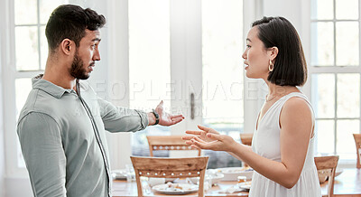 Buy stock photo Shot of a young couple having an argument at home