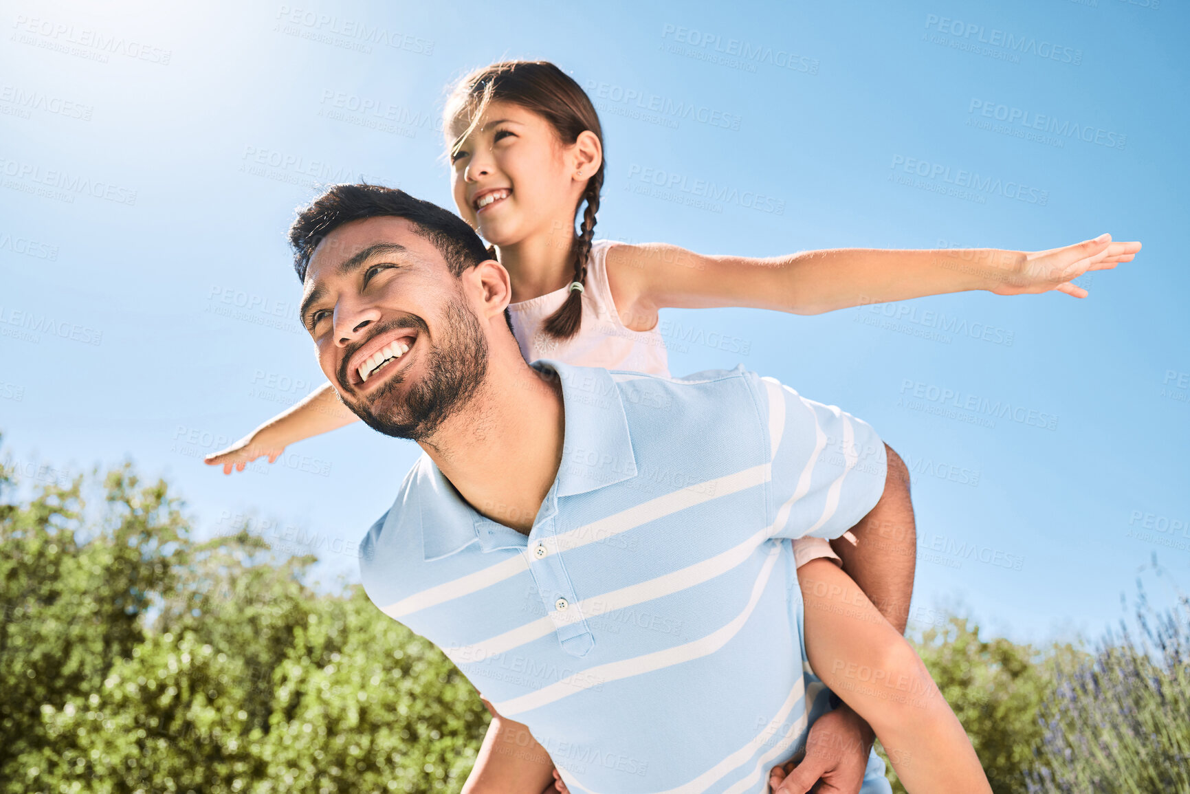 Buy stock photo Shot of an adorable little girl and her father having a fun day at the park