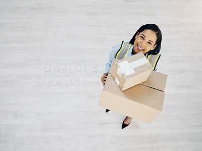 Buy stock photo Boxes, portrait and a courier or delivery woman from above for logistics, cargo or shipping industry. Happy female worker with cardboard box or package for supply chain or distribution service mockup