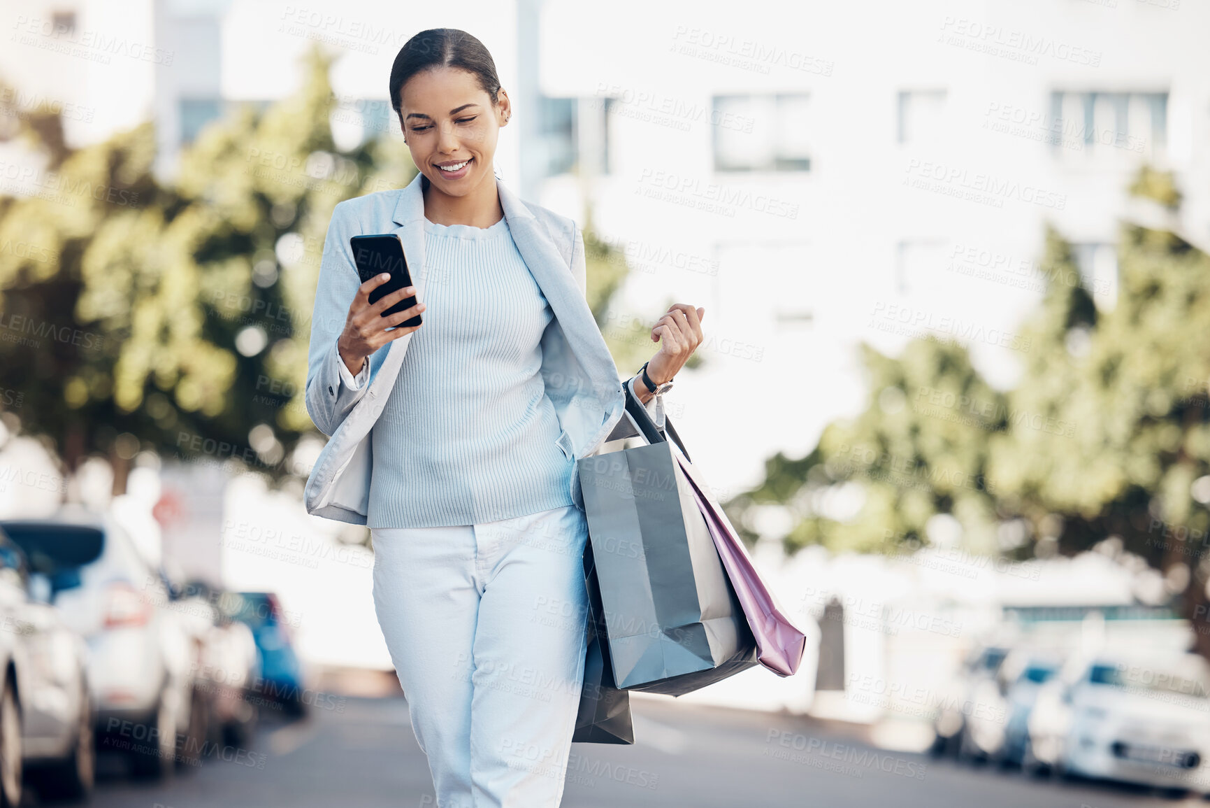 Buy stock photo Happy woman, phone and shopping bag in city for social media, communication or networking outdoors. Female person or shopper on mobile smartphone app for online chat walking in street of a urban town