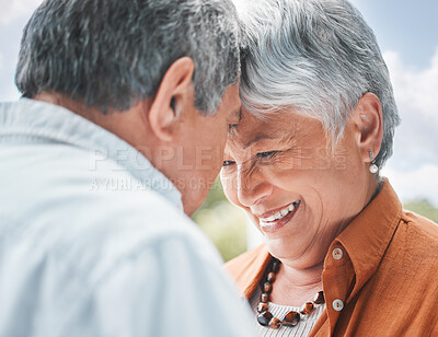 Buy stock photo Senior couple, touch forehead and love in nature for trust, romance or celebrating milestone with travel. Elderly people, marriage or affection outdoor for healthy relationship, commitment or support