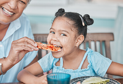 Buy stock photo Girl, grandmother and eating outside for pizza lunch with happiness or bonding on visit with excited guest. Mature woman, home and table with food or meal, smile and fun on holiday with playful child