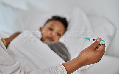 Buy stock photo Shot of an unrecognizable parent checking a sick boy's temperature at home