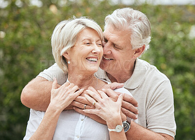 Buy stock photo Shot of a senior couple standing together outside