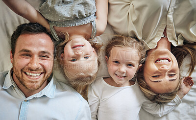 Buy stock photo Portrait, relax and children with parents on bed for bonding, security and having fun together. Happy, home and girl kids laying with family resting in bedroom at house in London from above.