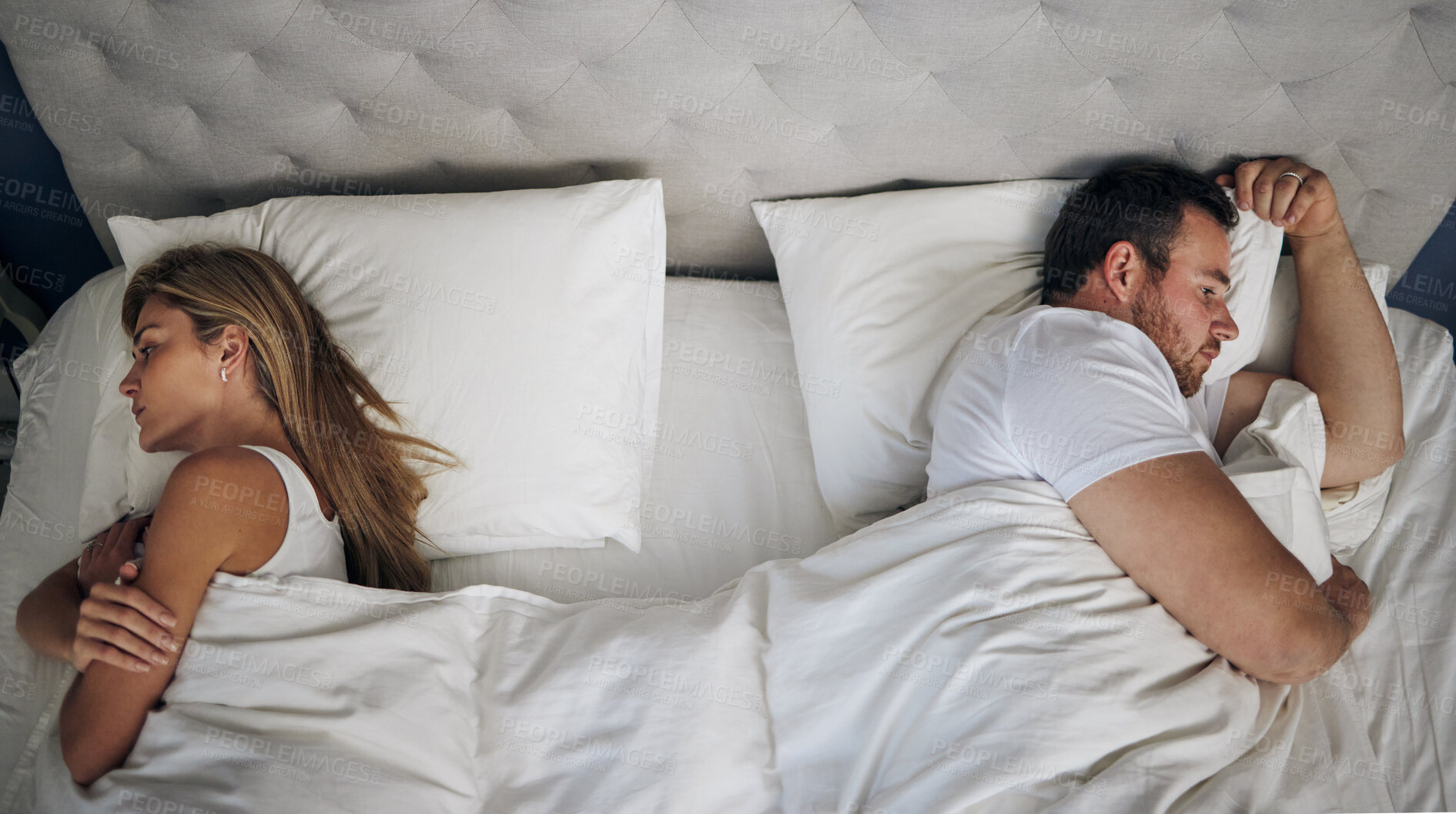 Buy stock photo Frustrated couple, bed and above with argument for fight, conflict or cheating affair at home. Top view, man and woman with seperation for disagreement, toxic marriage or bad relationship in bedroom
